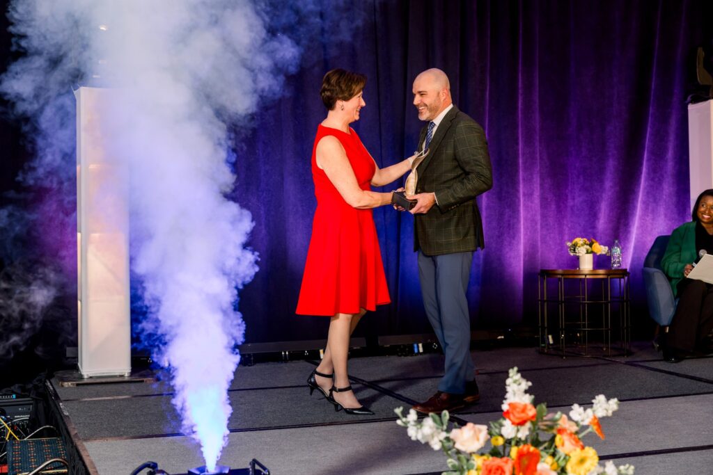 Barb Bowker receives her Athena Award