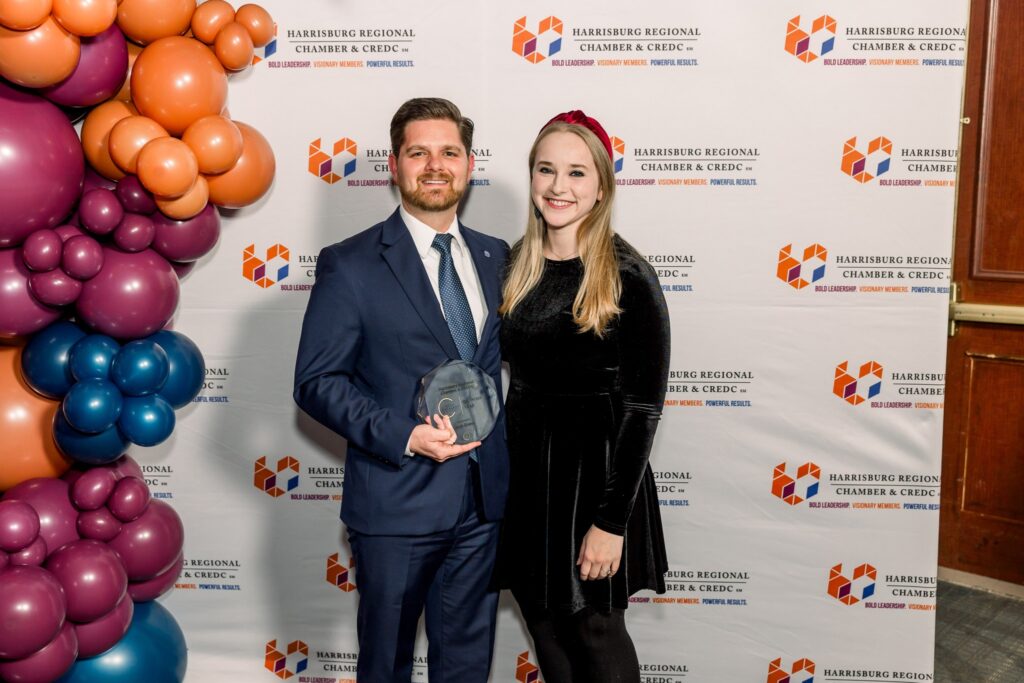 Josh Eisner poses with his wife at the Catalyst Awards